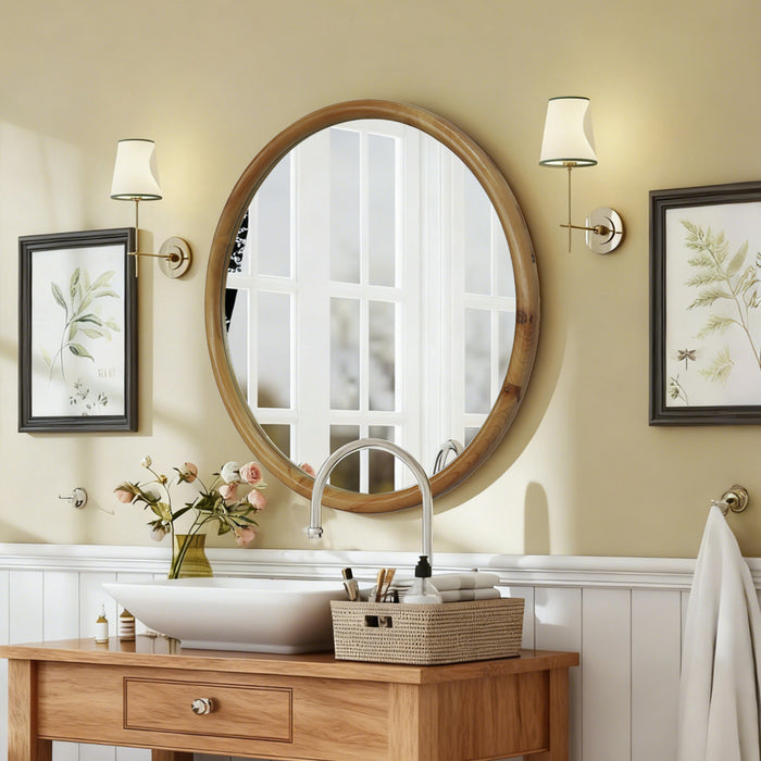 Espejo redondo de madera natural Casa Nuvé sobre tocador de baño