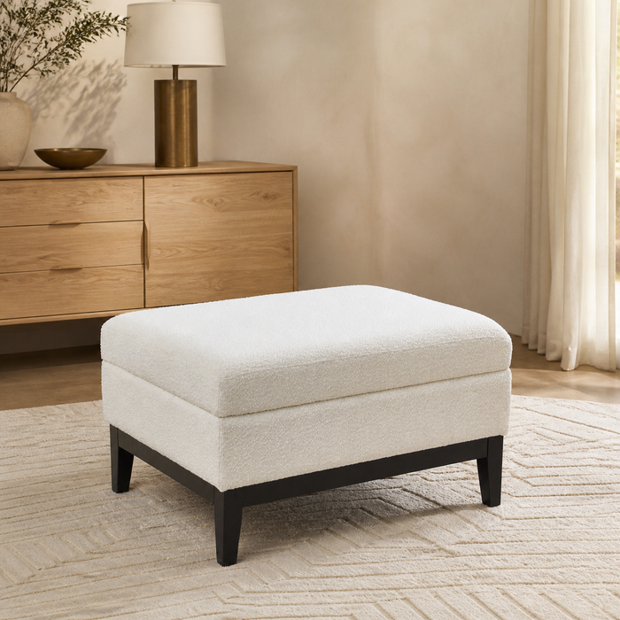 Ivory bouclé storage ottoman with reversible lid in a warm Casa Nuvé living room