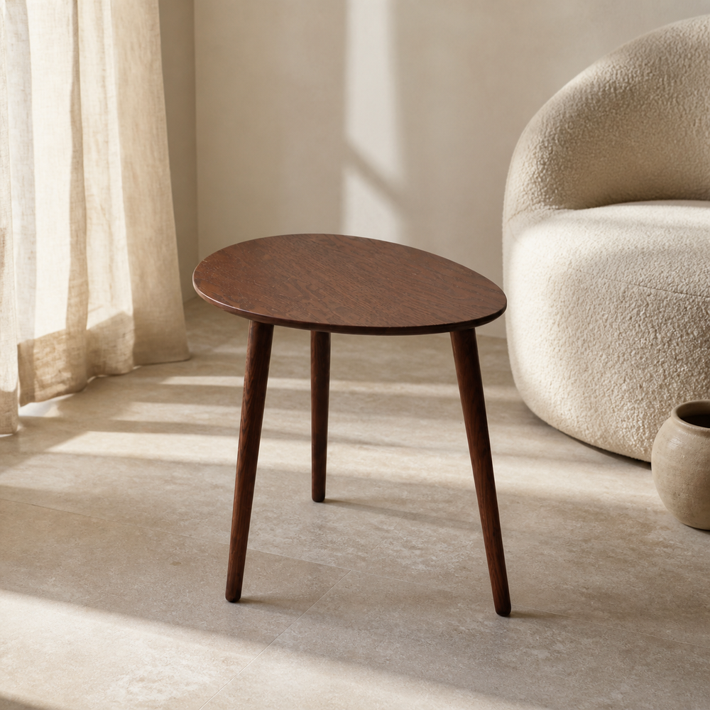 Alder oval solid oak side table in a warm minimalist Casa Nuvé interior