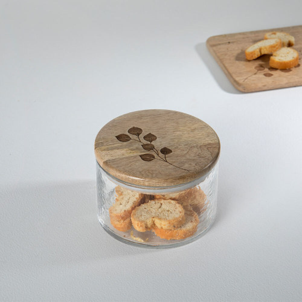 Frasco de vidrio con tapa de madera grabada con hojas Casa Nuvé